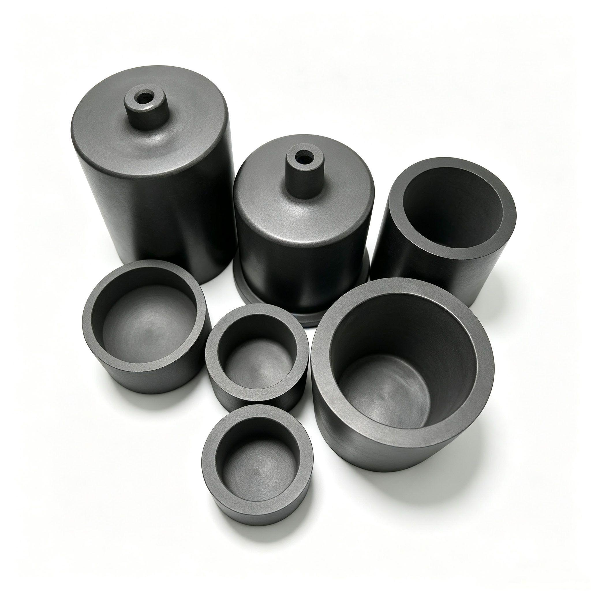 Creusets en graphite avec trous centraux | Tiges/buses de bouchon pour machines de coulée sous vide | Composants de fusion de graphite personnalisés résistant aux hautes températures