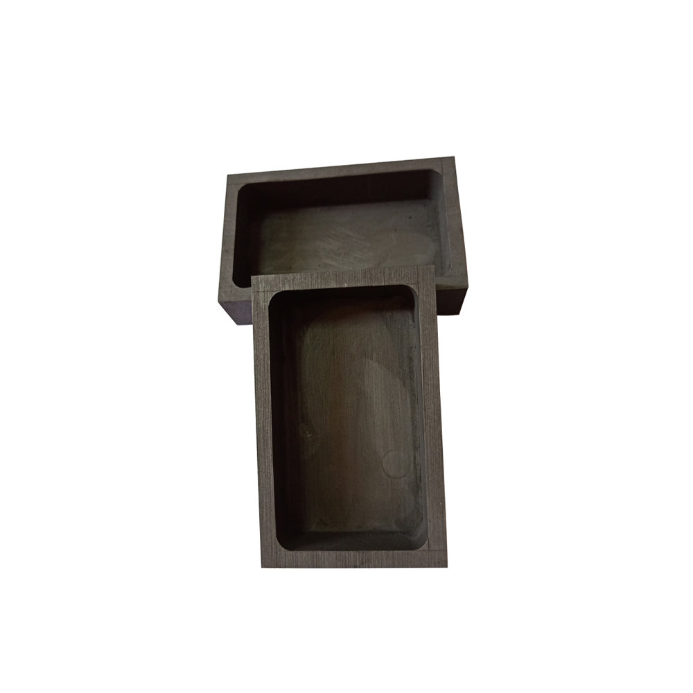 Deux bo&icirc;tes de frittage rectangulaires en graphite empil&eacute;es, id&eacute;ales pour le traitement par lots de mat&eacute;riaux dans des fours &agrave; haute temp&eacute;rature